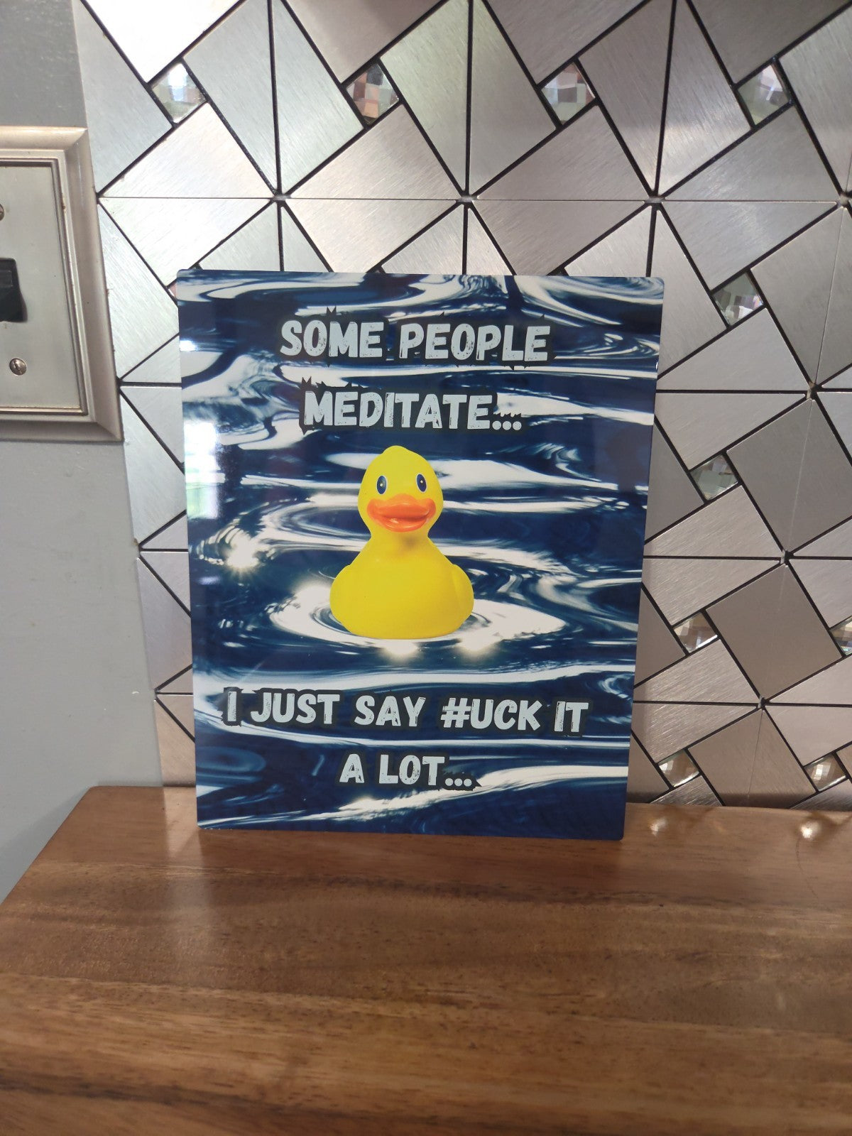 Funny sign about meditation vs saying...Duck it?